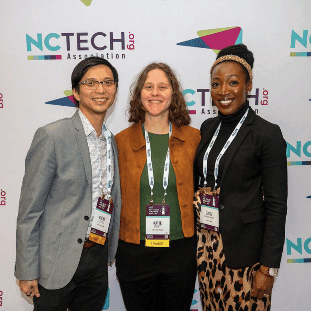Code the Dream's Ricky Leung, Katie Brey, and Daisy Magnus-Aryitey at the NC TECH award ceremony.